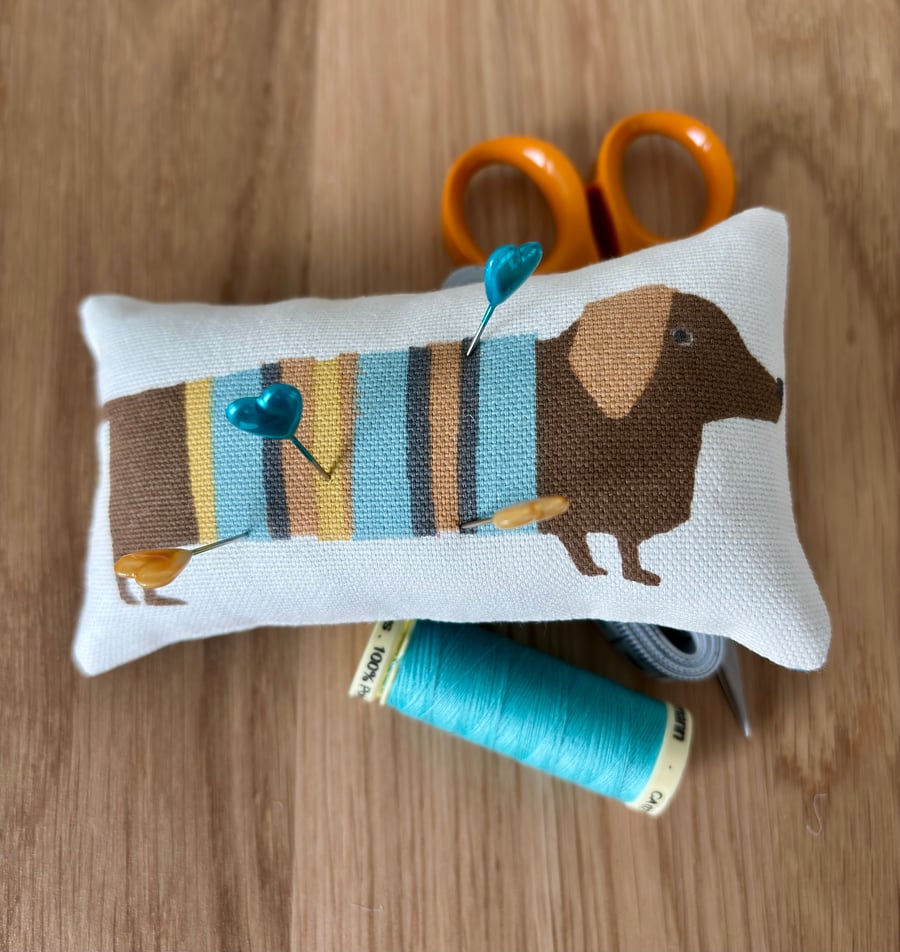 Cute “dachshund” pincushion with teal blue back