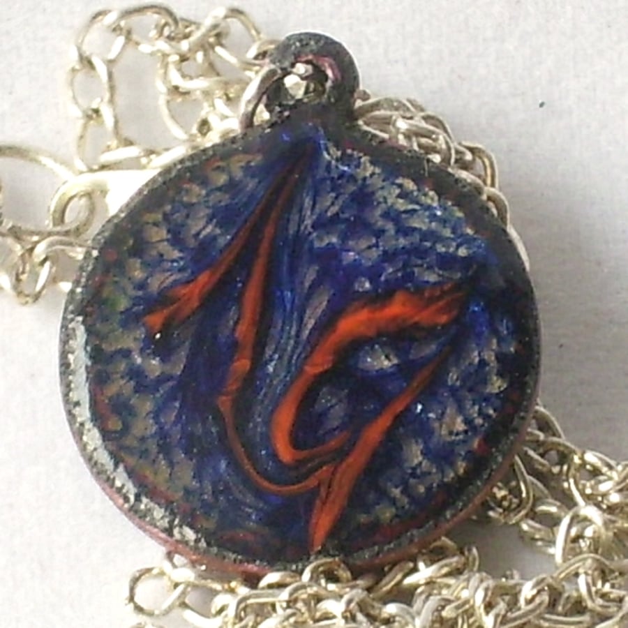 pendant: small round  scrolled red on blue over clear enamel