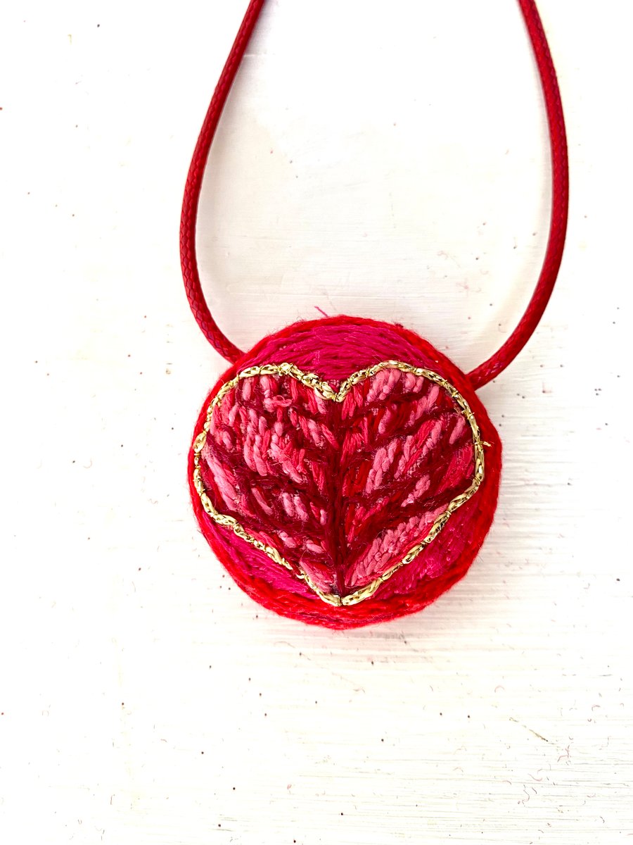 Hand embroidered heart pendant