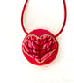 Hand embroidered heart pendant