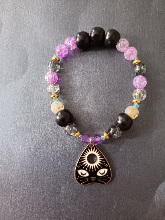 Elasticated beaded bracelet with black cat planchette charm
