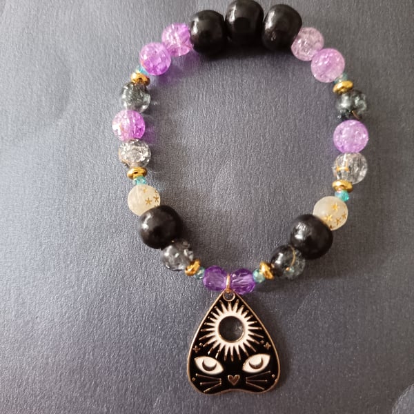Elasticated beaded bracelet with black cat planchette charm
