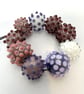 Handmade brown patterned lamp work glass beads - Image 1