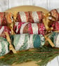 Set of three Christmas crackers. Waves and swirls with gold accents