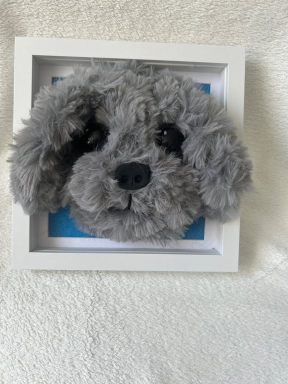 Needle felted puppy heads in frame