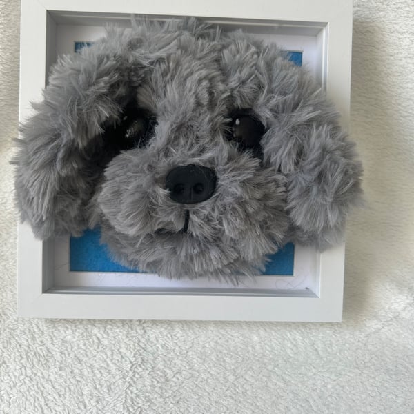 Needle felted puppy heads in frame