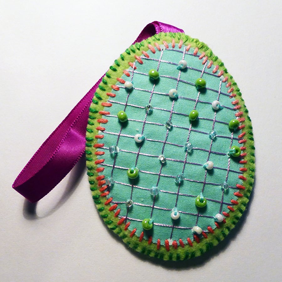 Decoration - Hanging oval - purple ribbon.