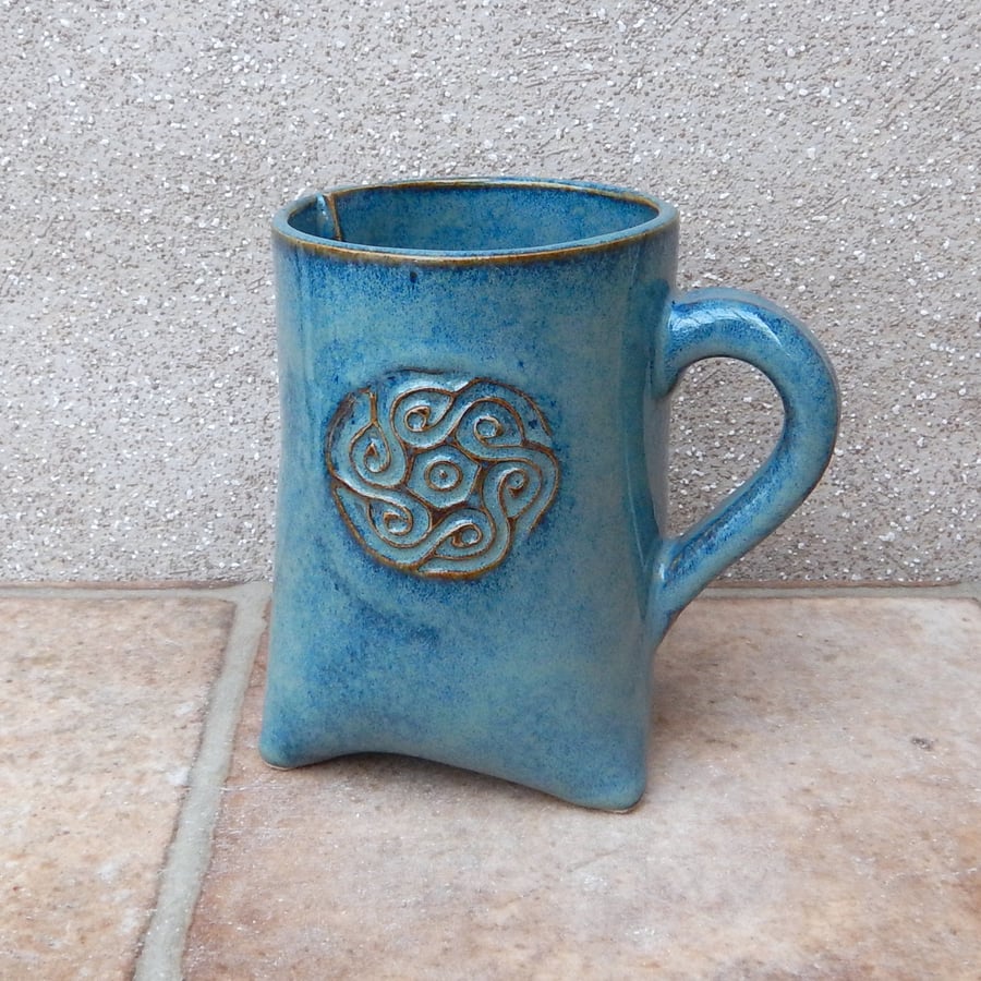 Tripod coffee mug tea cup with a celtic motif handmade in stoneware pottery 