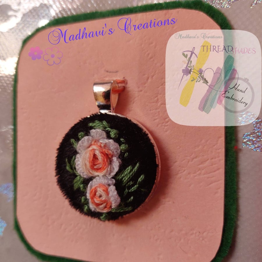 Hand embroidered rose motif pendant
