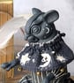 'Lumen', a black porcelain and textile mouse imp.