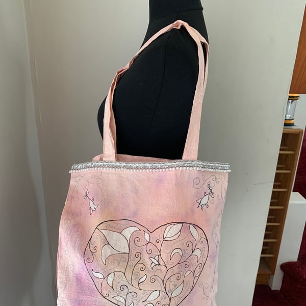 Tie dyed and had painted tote bag with filigree heart design 