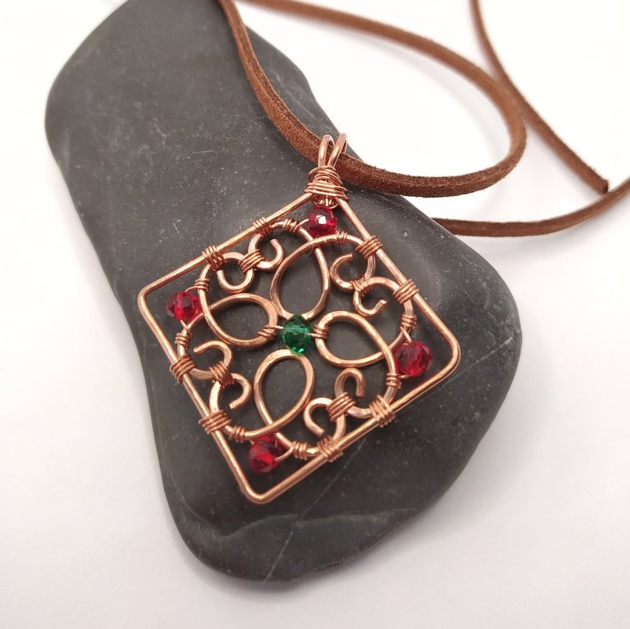 Square Shaped Swirly Copper Pendant with Green and Red Glass Beads