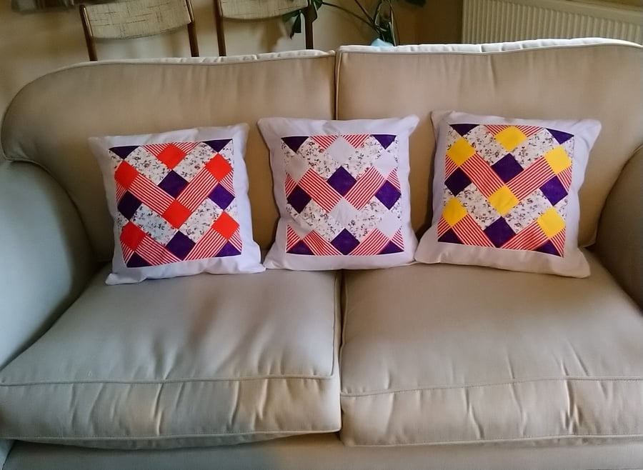 Patchwork cushion covers in red, yellow and purple. Three  available. 
