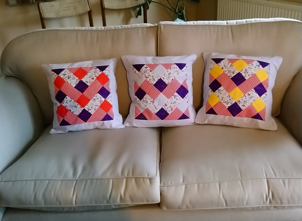 Patchwork cushion covers in red, yellow and purple. Three  available. 