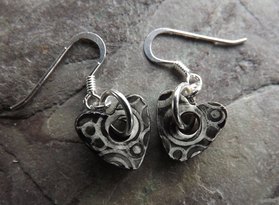 Heart shaped ceramic and sterling silver earrings in black