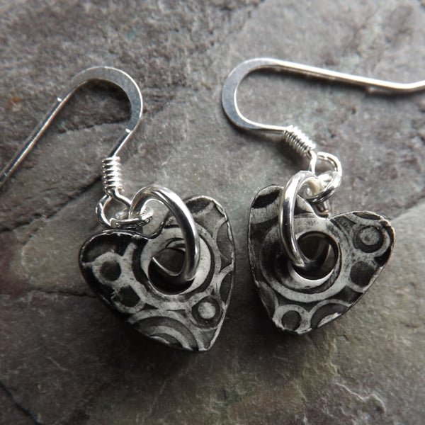 Heart shaped ceramic and sterling silver earrings in black