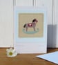 Hand-stitched rocking horse applique mounted on card - lots of detail, to frame?