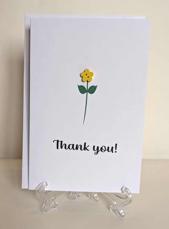 Thank you greetings card with a flower button 