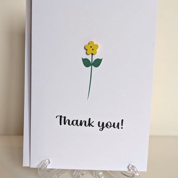 Thank you greetings card with a flower button 