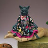 'Gretta', a black porcelain and textile mouse doll.