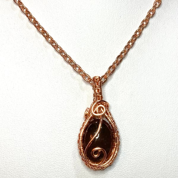 copper wire wrapped colour changing glass pendant 