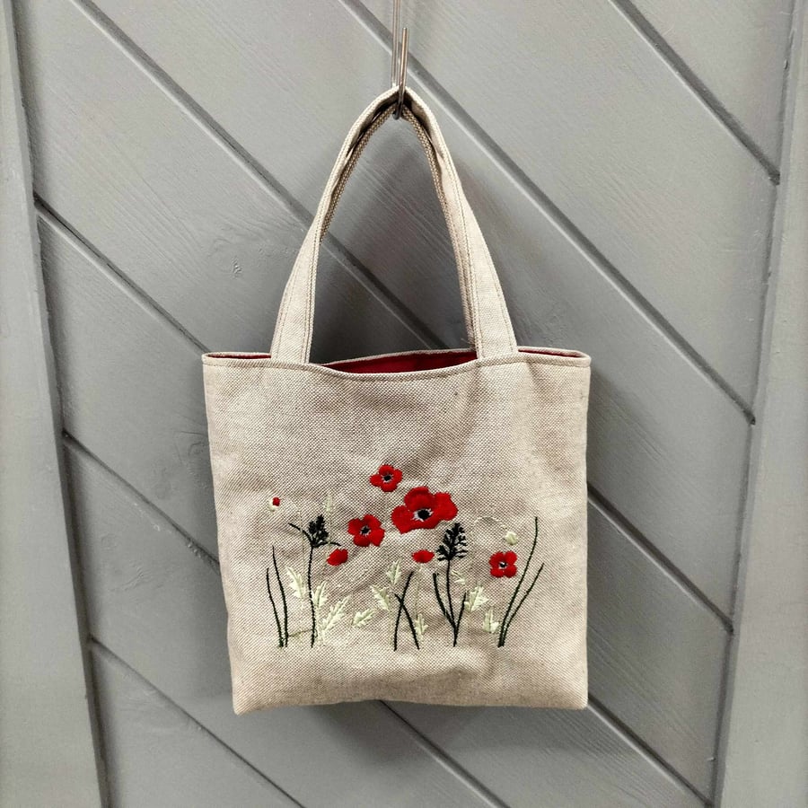 Linen look small tote bag with poppy meadow embroidery