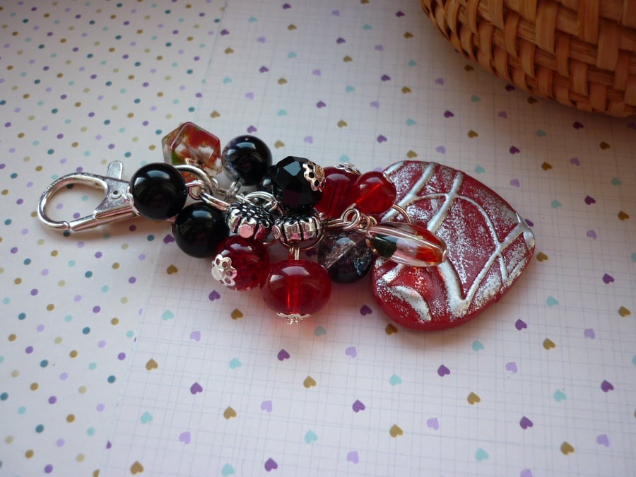 RED, BLACK AND SILVER HEART BAG CHARM.  988