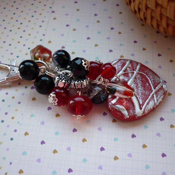 RED, BLACK AND SILVER HEART BAG CHARM.  988