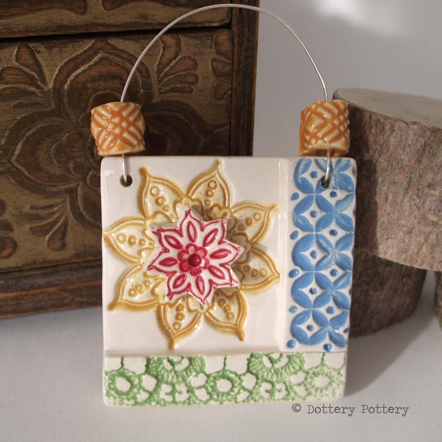 Small decorative ceramic tile with handmade beads patchwork design