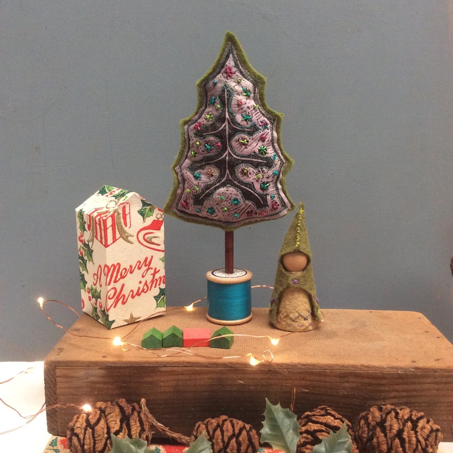 Cotton reel Christmas tree with a turquoise base