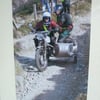 Photographic greetings card of a motorbike and sidecar on the Lands End Trial.