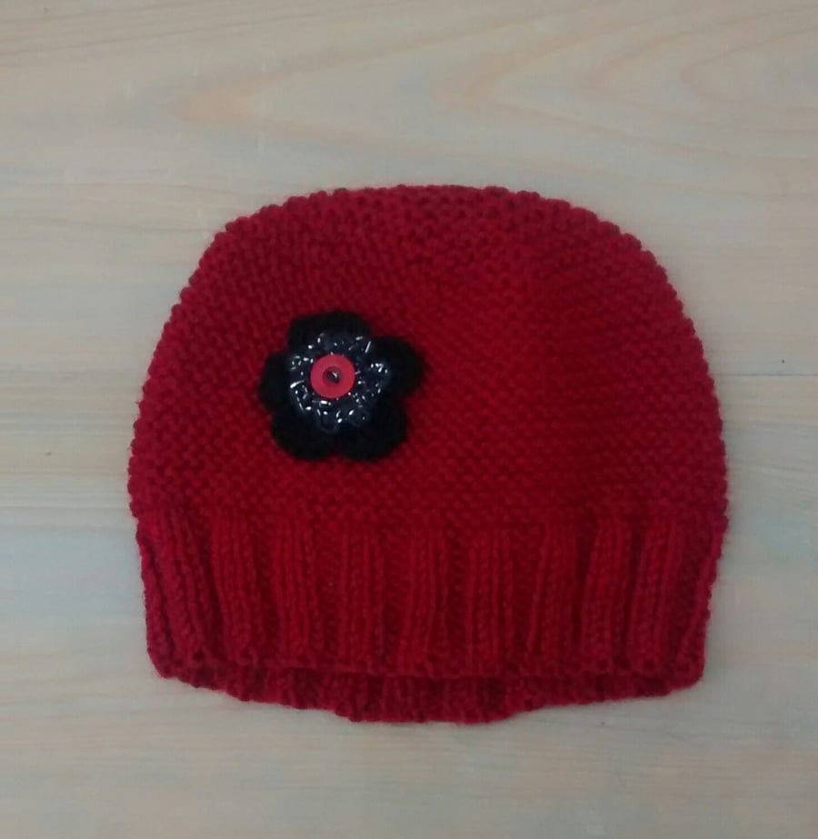 Red Hat with Black Crochet Flower