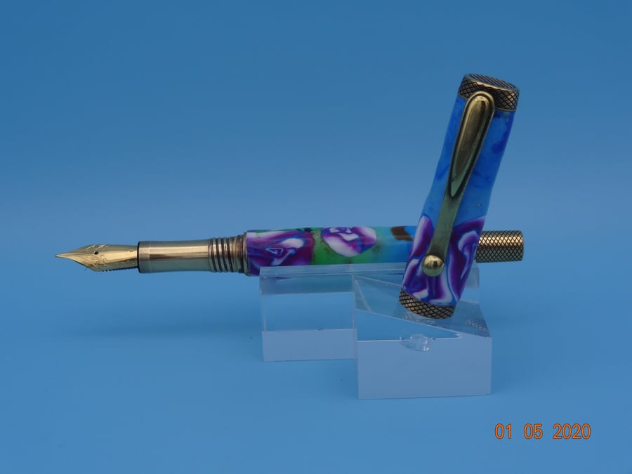 Fountain Pen with turned polymer clay barrel and lid.