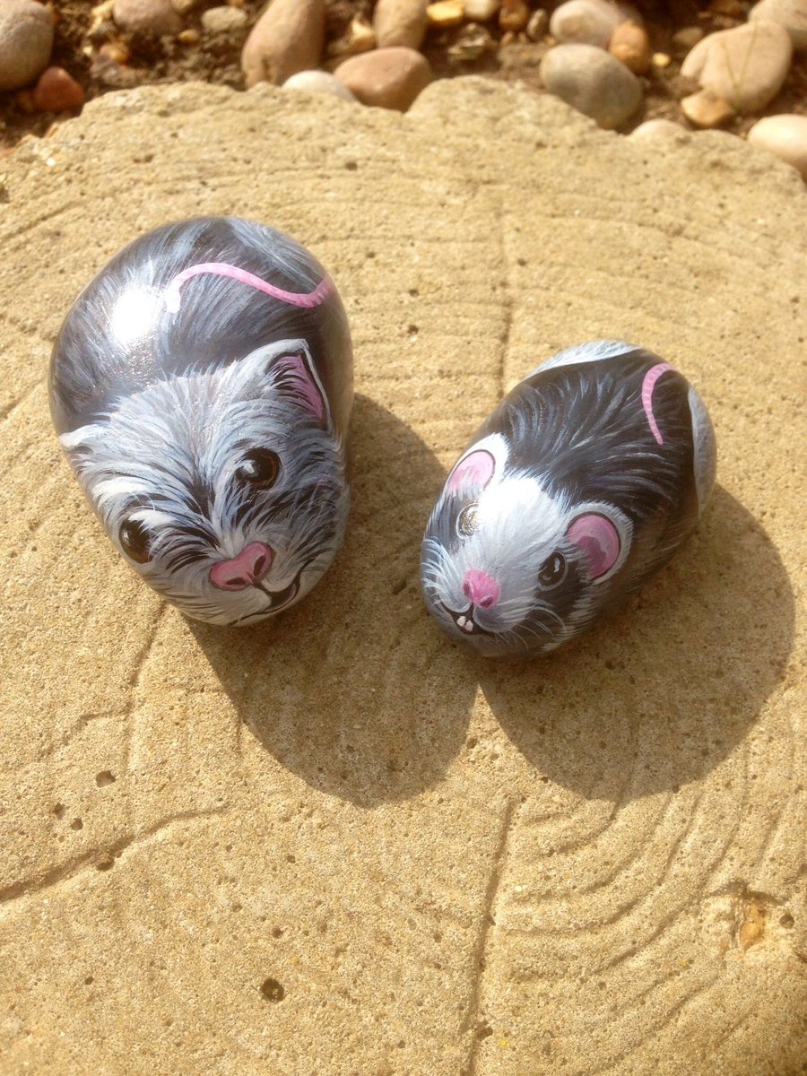 Two little mice painted on stones 