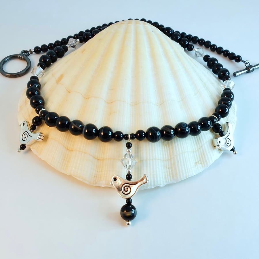 Black Onyx Necklace With Silver Bird Charms And Swarovski Crystals.