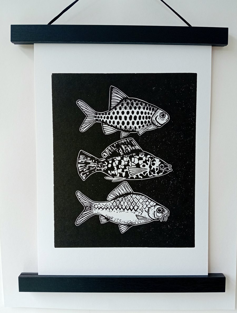 Linocut print of Three Little Fish handprinted in black