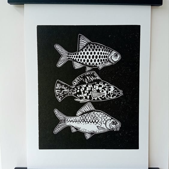 Linocut print of Three Little Fish handprinted in black