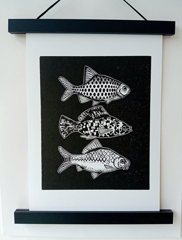 Linocut print of Three Little Fish handprinted in black