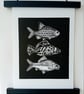 Linocut print of Three Little Fish handprinted in black - Image 1