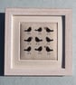 Small framed hand-stitched textile of blackbirds with bright red berries - Image 2
