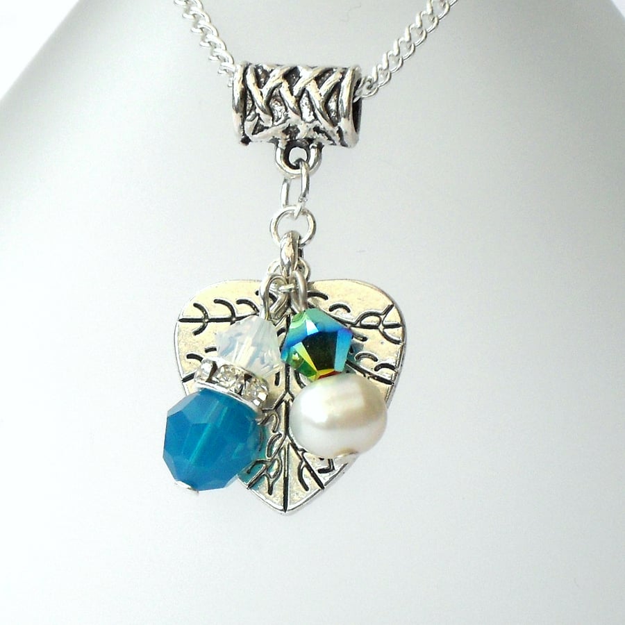 Handmade leaf charm necklace with pearl and crystals by Swarovski®