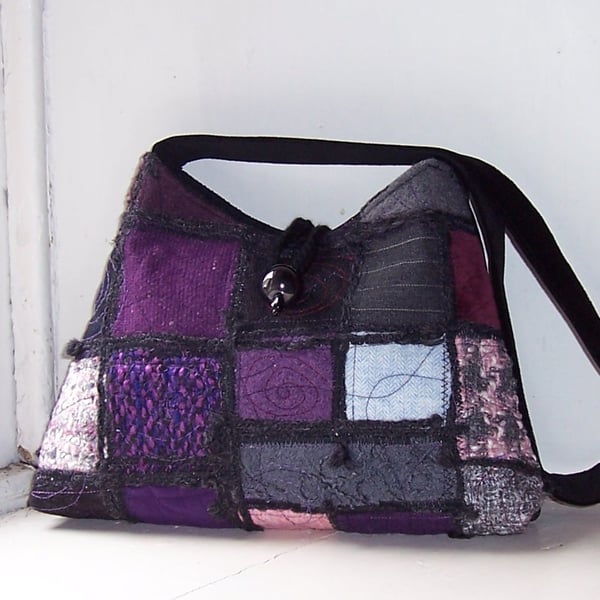 Textile art shoulder bag in purple, black and pink patchwork