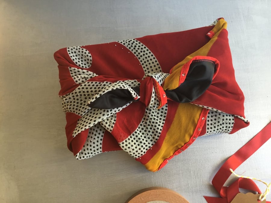Fabric gift wrap Furoshiki-style, using re-purposed black, red and yellow sari
