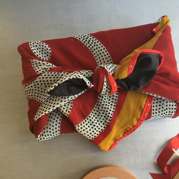 Fabric gift wrap Furoshiki-style, using re-purposed black, red and yellow sari