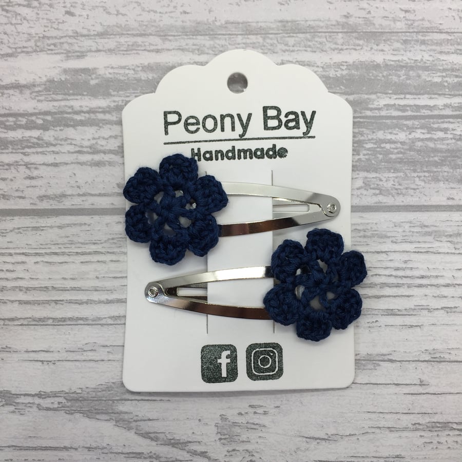 Girl’s hair clips with navy blue crocheted flowers
