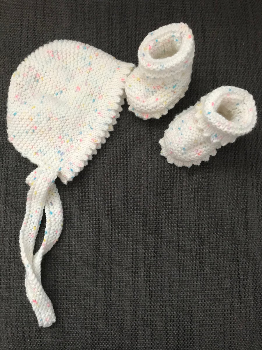 Hand knitted bonnet and bootees with a picot edging