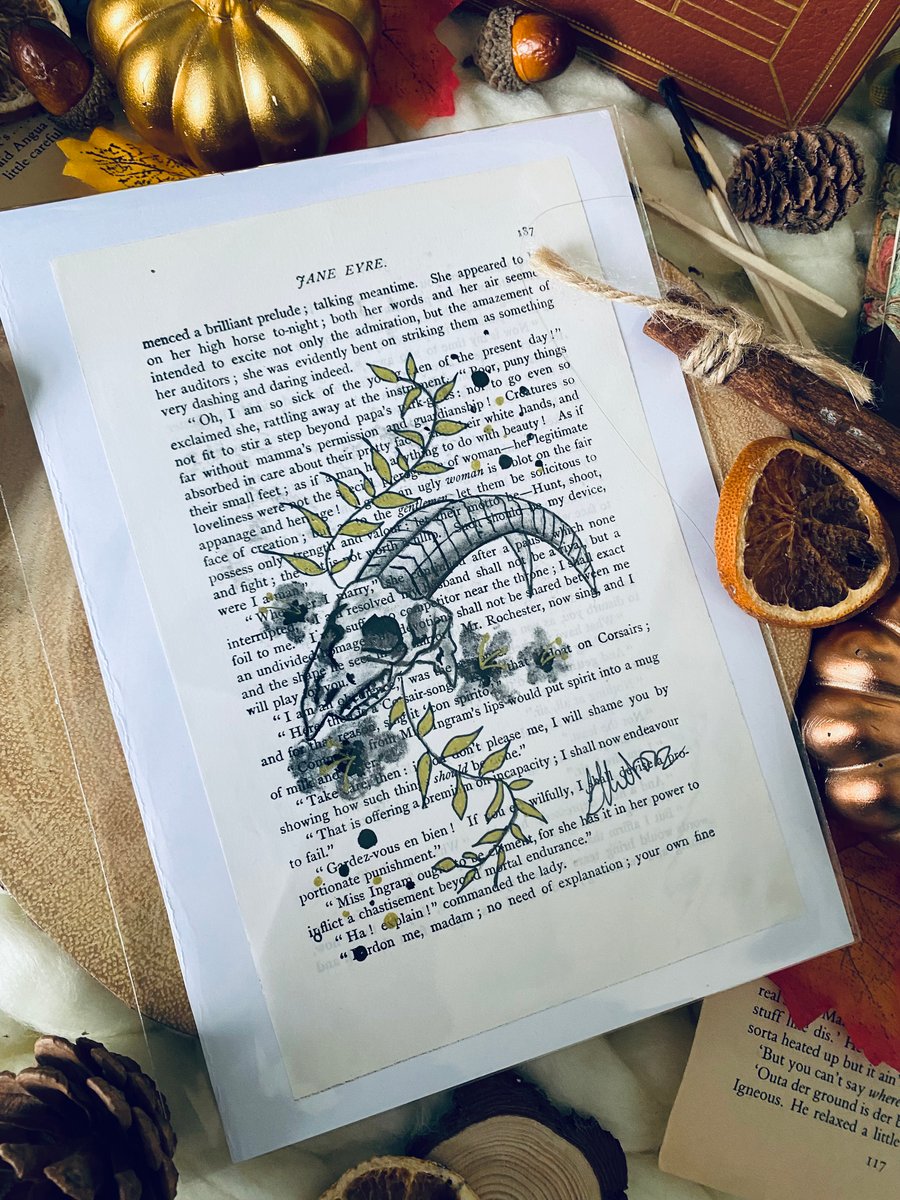 Gothic goat skull drawing on book pages