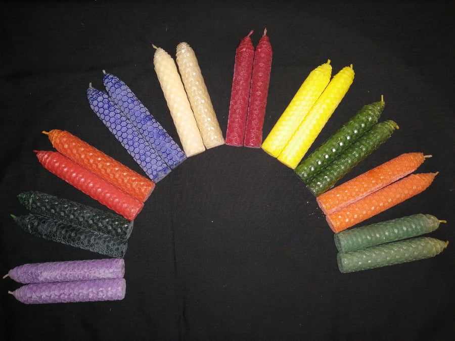 Small orange rolled beeswax candle