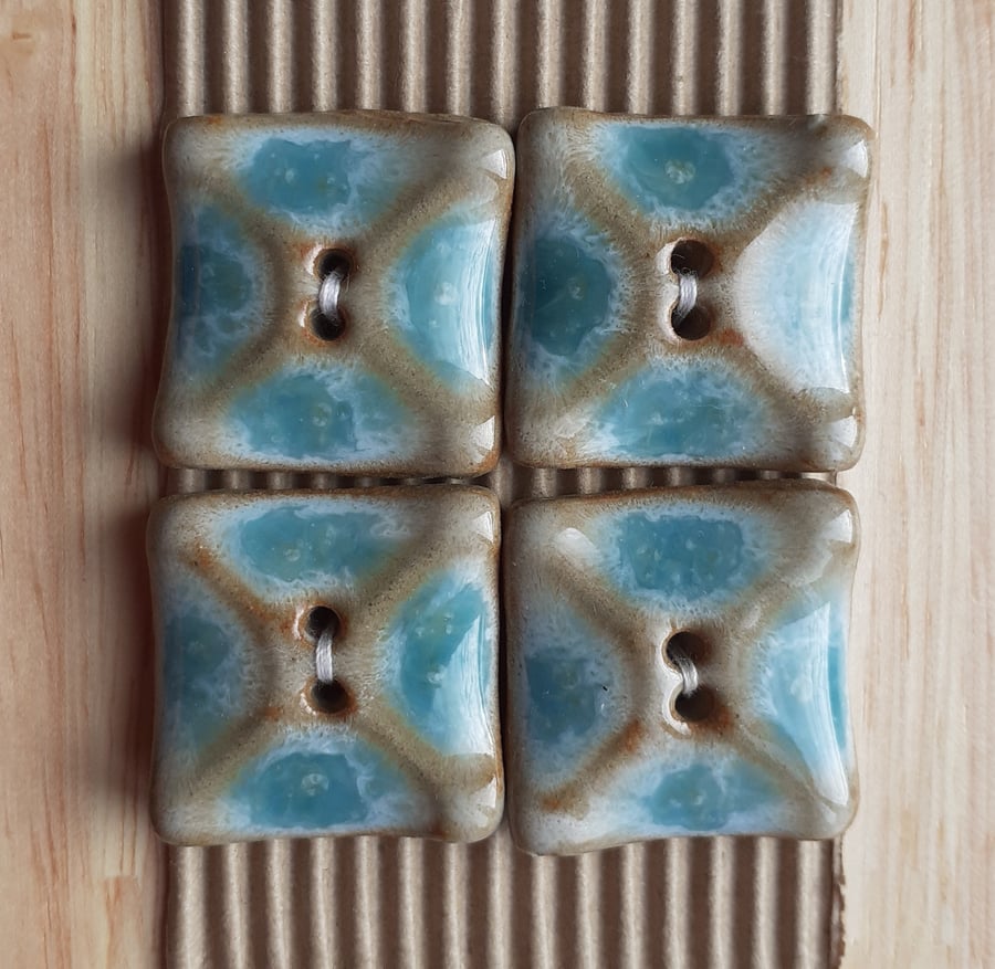 Set of 4 blue ceramic square shaped buttons 