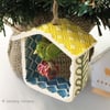 Small decorative pottery birdhouse hanging decoration with ceramic bird and bead